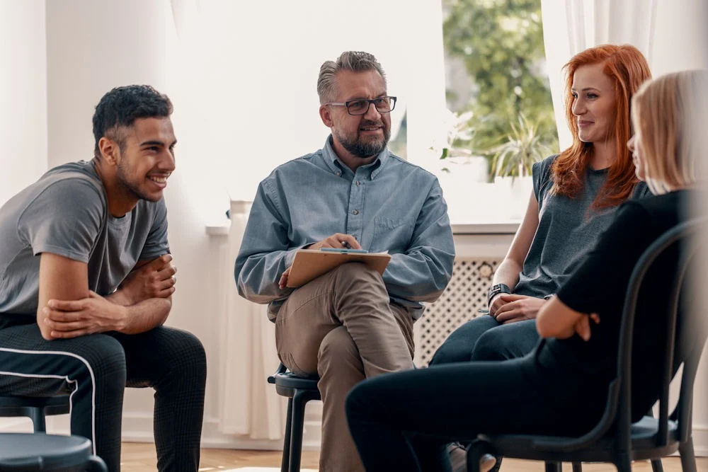 group-therapy-for-mental-health a group of people sitting in circle during therapy