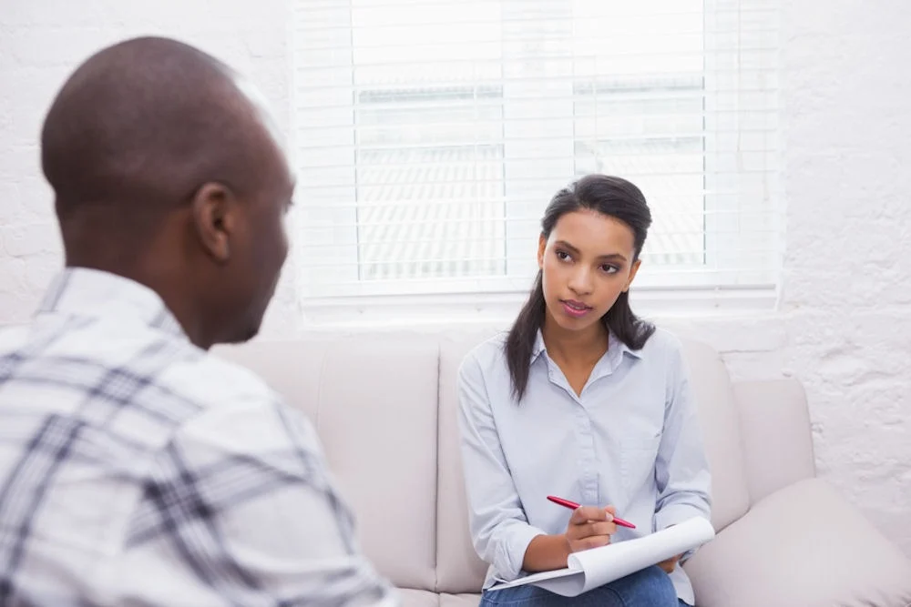 man consulting therapist about his antidepressant dosage