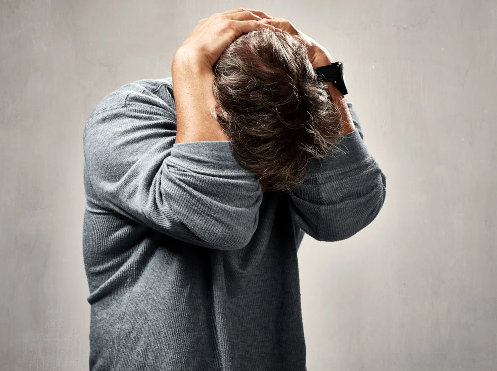 man showing visible signs and symptoms while suffering depression