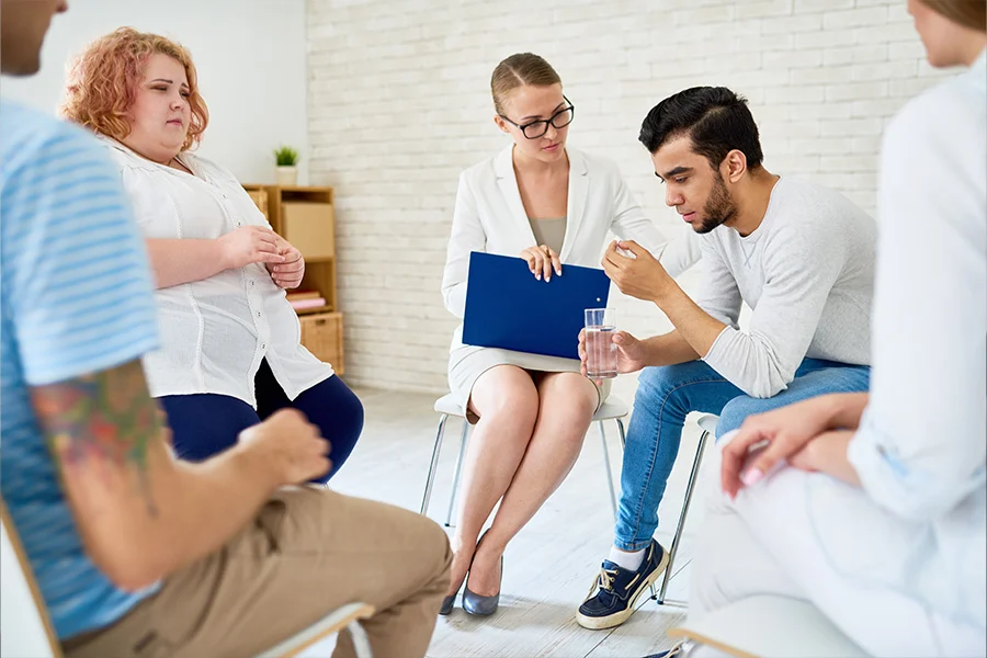 patients with therapist discussing in inpatient mental health care in orange county