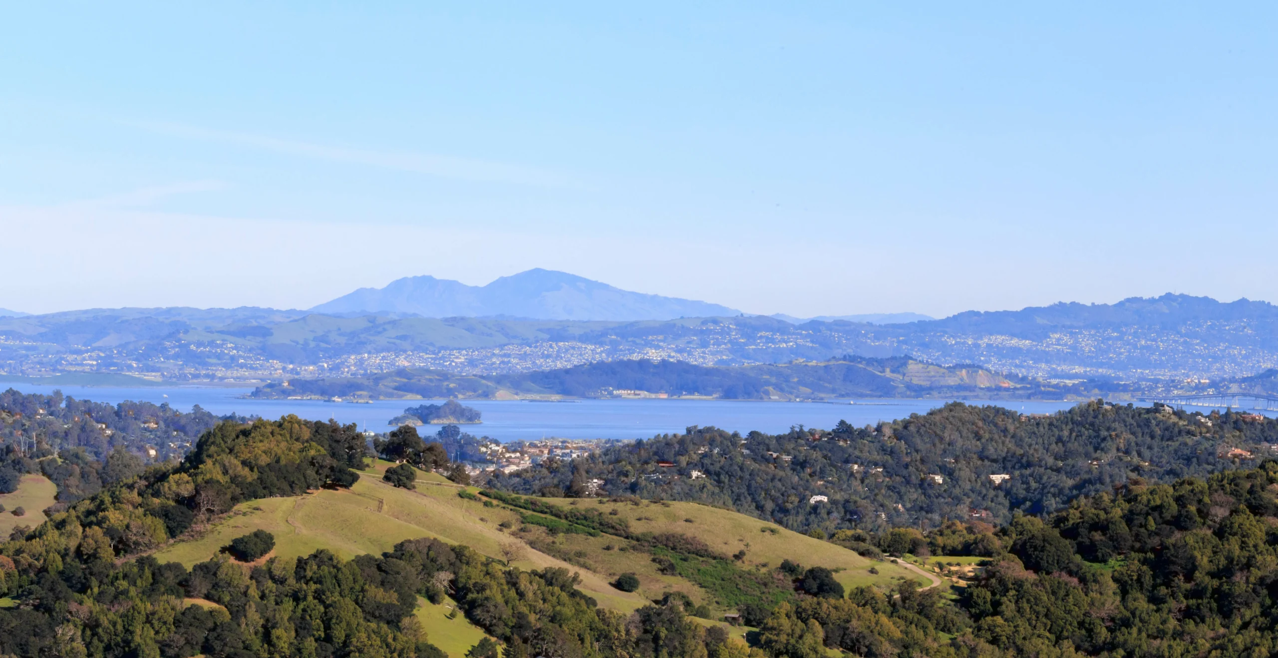 Green rolling hills of Marin County with view of San Francisco Bay