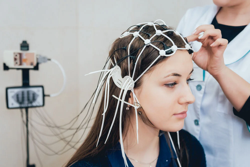 brain-mapping-mental-health young woman getting an EEG for brain mapping for mental health