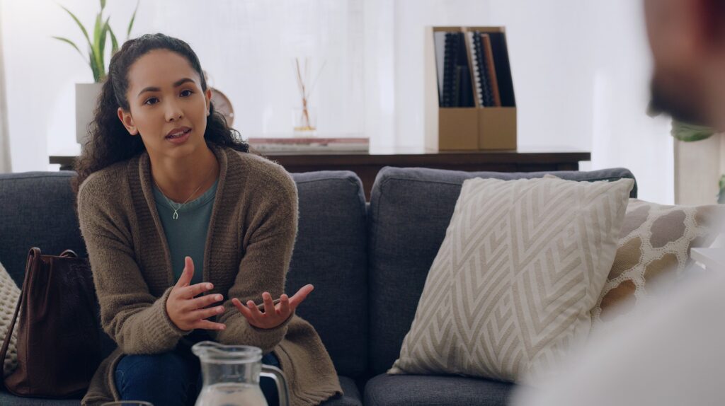 a woman suffering from PTSD talking to her therapist