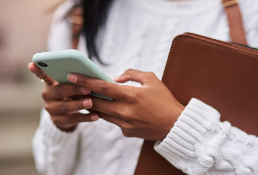 Person searching on phone to learn what is pure OCD and find mental health support.